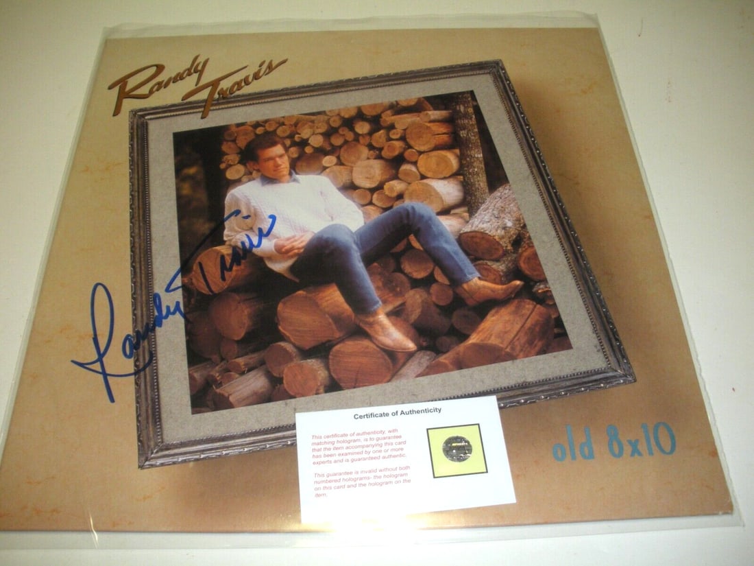 Randy Travis Signed 8x10 LP Record with COA Country Legend: Randy Travis Signed 8x10 LP Record with COA Country Legend This item is an original 8x10 LP record album signed by the legendary country artist Randy Travis, who is a celebrated member of the Country