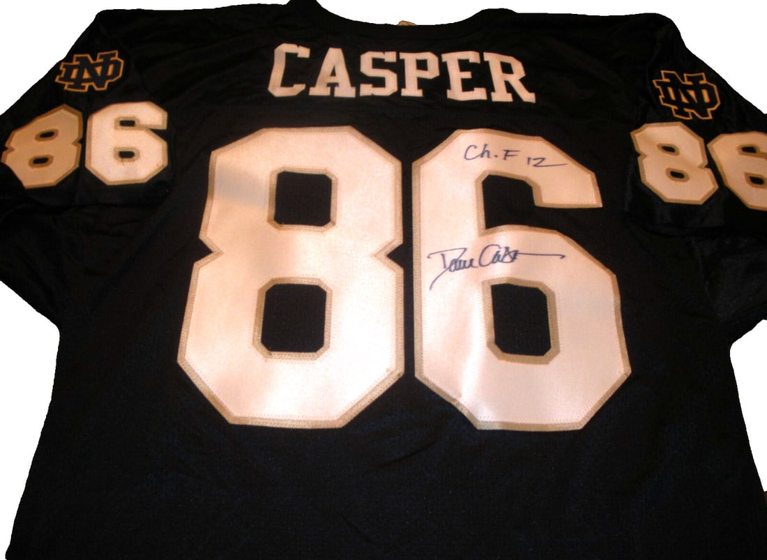 Dave Casper Notre Dame Signed Wilson Jersey with COA Rare Collectible: Dave Casper Notre Dame Signed Wilson Jersey with COA Rare Collectible This officially licensed Wilson jersey features a rare signature from legendary Notre Dame Irish player Dave Casper. The jersey is