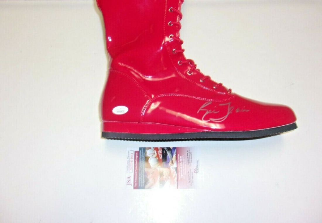 Ric Flair Signed Championship Boot JSA/COA Wrestling Collectible: Ric Flair Signed Championship Boot JSA/COA Wrestling Collectible This is a pre-owned wrestling championship boot signed by the legendary Ric Flair, known as the "Nature Boy". This item is an original