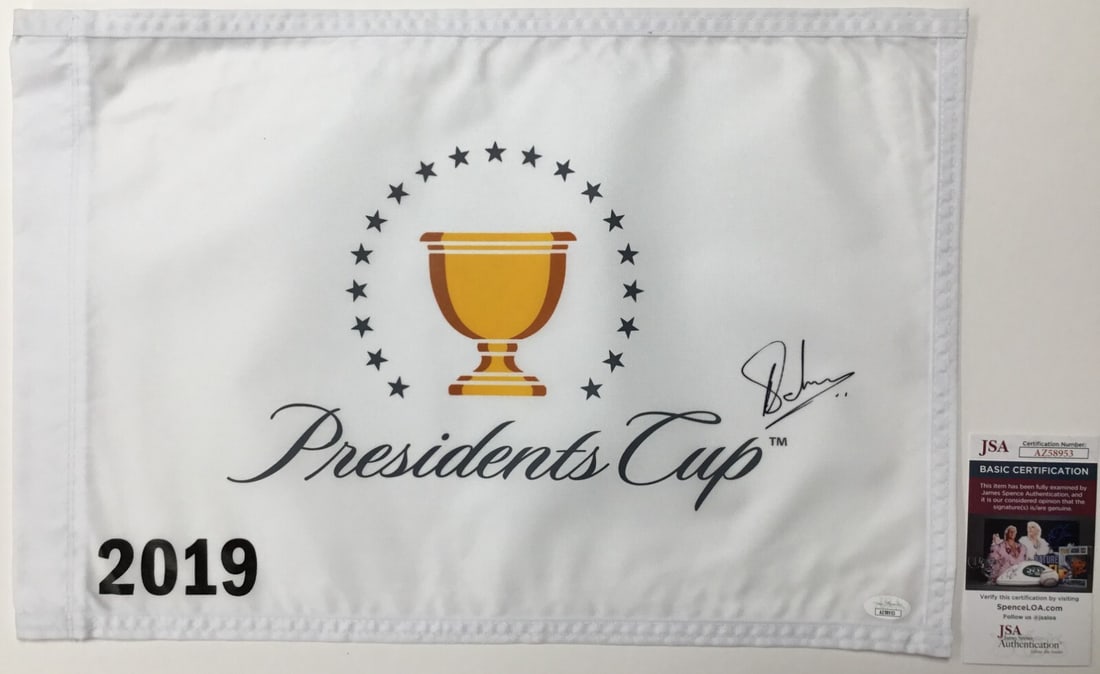 Adam Hadwin Signed 2019 President's Cup Pin Flag JSA Certified: Adam Hadwin Signed 2019 President's Cup Pin Flag JSA Certified Celebrate the world of golf with this officially licensed 2019 President's Cup pin flag, signed by PGA star Adam Hadwin. This original pi