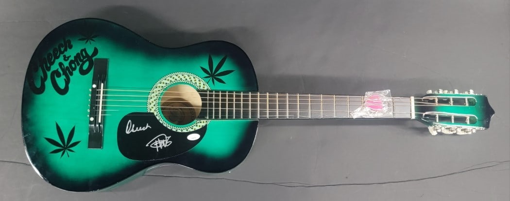 Cheech & Chong Hand Signed Acoustic Guitar JSA Authenticated: Cheech & Chong Hand Signed Acoustic Guitar JSA Authenticated This unique acoustic guitar features the authentic signatures of the iconic duo Cheech Marin and Tommy Chong, making it a must-have for fan