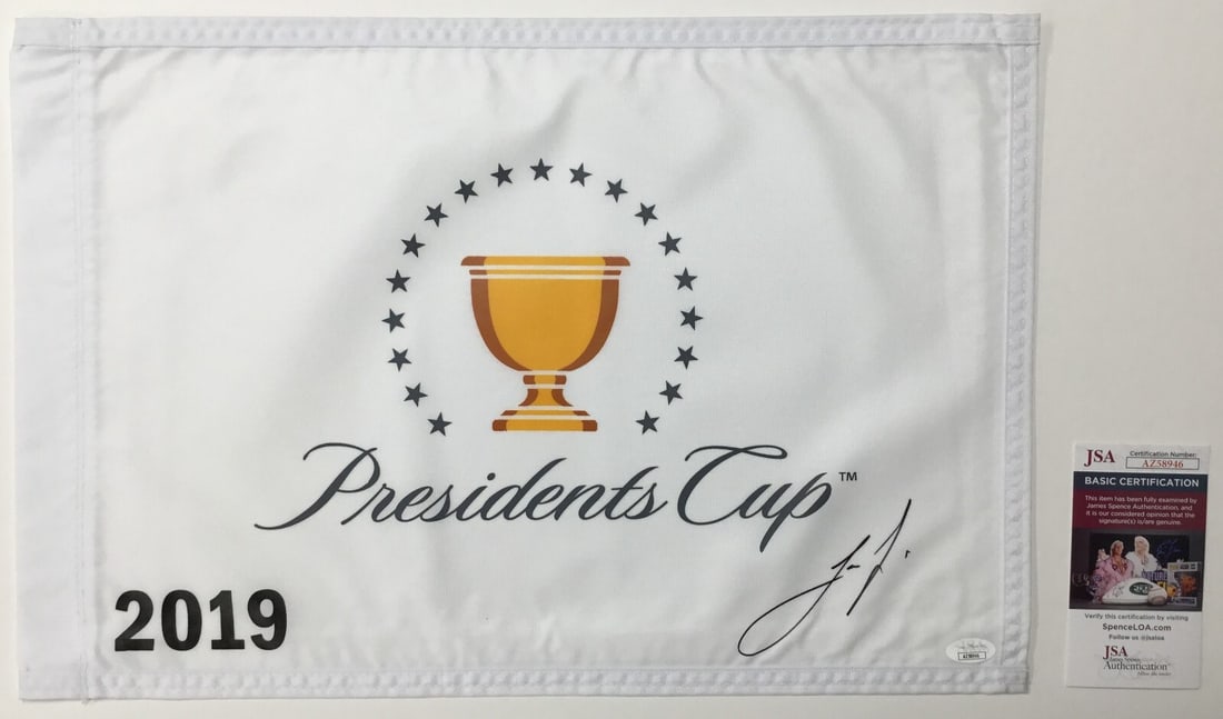 Joaquin Niemann Signed 2019 President's Cup Pin Flag JSA Authenticated: Joaquin Niemann Signed 2019 President's Cup Pin Flag JSA Authenticated This official pin flag from The President's Cup 2019 features the autograph of PGA star Joaquin Niemann. The signature has been a