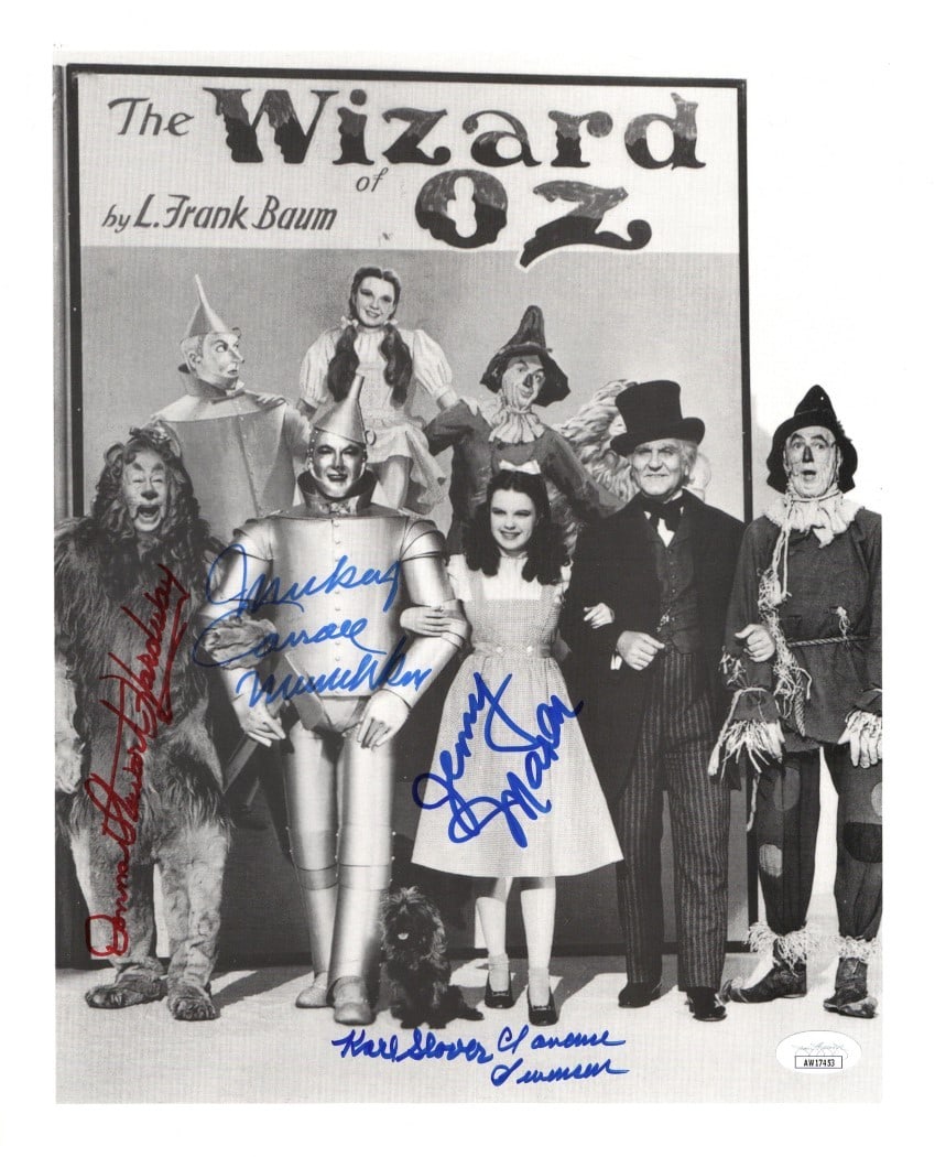 Wizard of Oz Munchkins Multi Signed 11x13.5 Photo 5 Autographs JSA: Wizard of Oz Munchkins Multi Signed 11x13.5 Photo 5 Autographs JSA This is an original 11" x 13.5" photograph featuring the beloved Munchkins from the classic film, The Wizard of Oz. The photo is mult