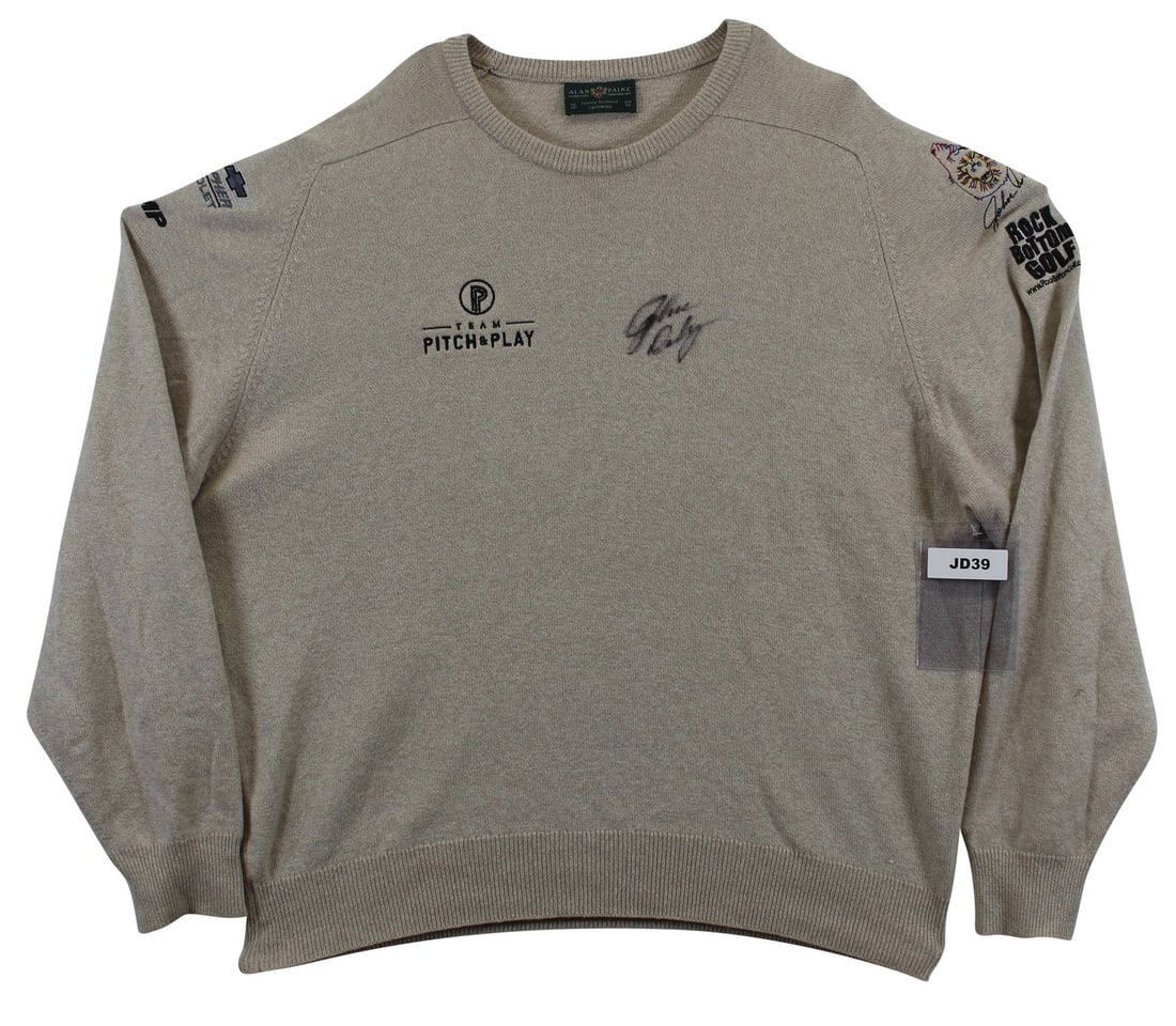 John Daly Signed Match Worn Black Cashmere Sweater BAS Authenticated: John Daly Signed Match Worn Black Cashmere Sweater BAS Authenticated This match worn black cashmere sweater by Alan Paine has been personally signed by professional golfer John Daly. The item is part