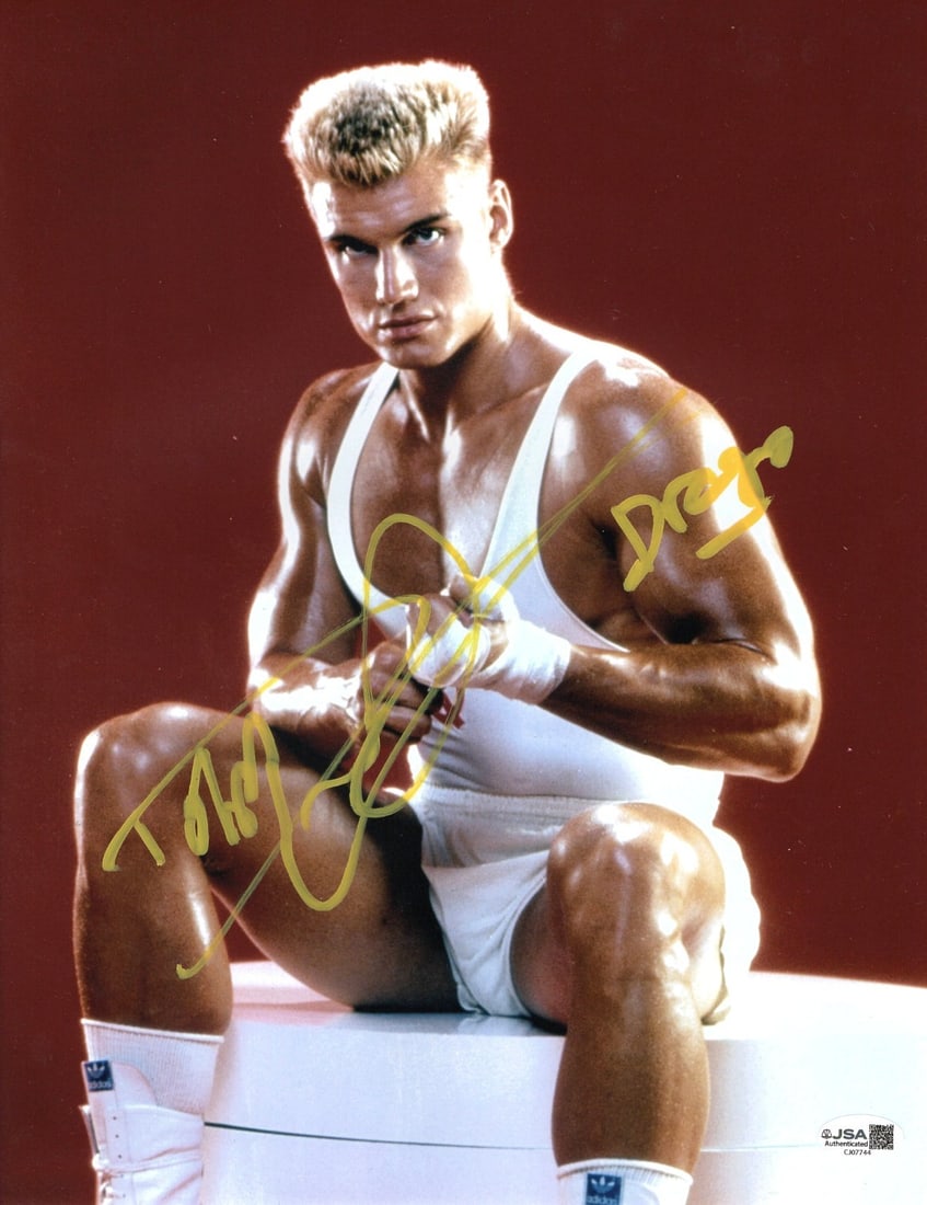Dolph Lundgren Signed 11x14 Photo Rocky IV Drago JSA Authenticated: Dolph Lundgren Signed 11x14 Photo Rocky IV Drago JSA Authenticated This is an authentic 11" x 14" photograph of Dolph Ludgren as "Drago" from the iconic film Rocky IV. The photo is signed by Dolph Lud