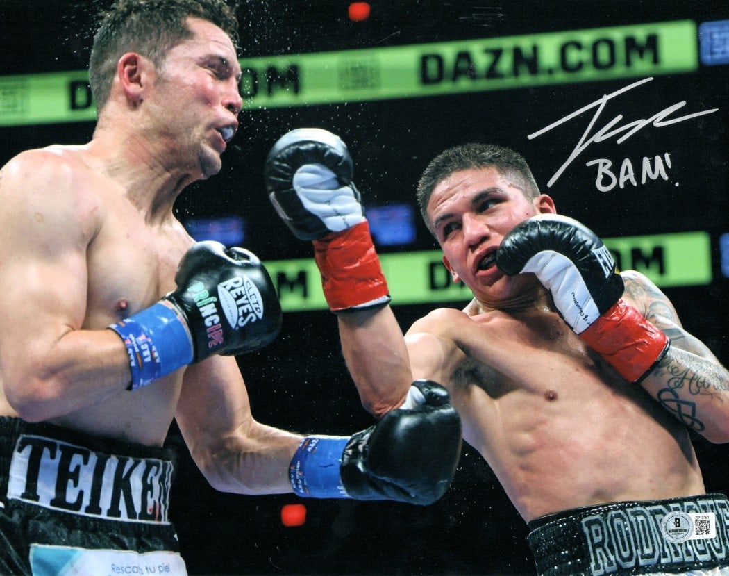 Jesse Rodriguez Autographed 11x14 Photo 'BAM!' Beckett Authenticated: Jesse Rodriguez Autographed 11x14 Photo 'BAM!' Beckett Authenticated This is an 11x14 autographed photo of boxer Jesse Rodriguez, featuring him landing a right hand with the iconic exclamation "BAM!"