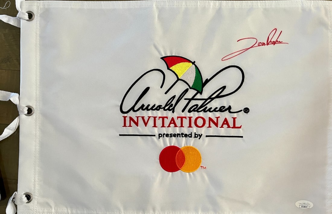 Jon Rahm Signed Arnold Palmer Flag JSA Authenticated: Jon Rahm Signed Arnold Palmer Flag JSA Authenticated Celebrate the legacy of golf with this official Arnold Palmer Invitational pin flag, beautifully signed by the talented Jon Rahm. This unique piece