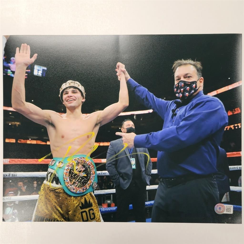 Ryan Garcia Signed 11x14 Boxing Photo Beckett Authenticated: Ryan Garcia Signed 11x14 Boxing Photo Beckett Authenticated This is a signed 11x14 photo of boxing star Ryan Garcia, authenticated by Beckett Authentication Services (BAS). The photograph features a s