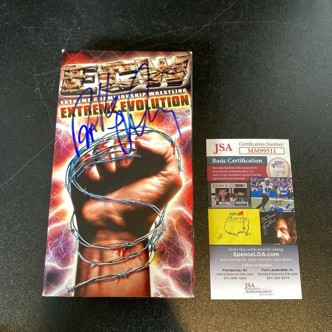 Balls Mahoney Autographed Vintage ECW VHS with JSA COA: Balls Mahoney Autographed Vintage ECW VHS with JSA COA This vintage VHS showcases the electrifying world of wrestling, featuring the legendary Balls Mahoney. Authentically signed by Mahoney himself, t