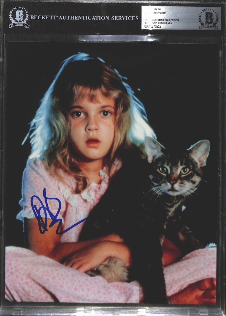 Drew Barrymore Signed 8x10 Photograph Beckett Authenticated: Drew Barrymore Signed 8x10 Photograph Beckett Authenticated This is an original 8x10 color photograph featuring Drew Barrymore, signed in blue permanent marker. The photograph captures a moment from t