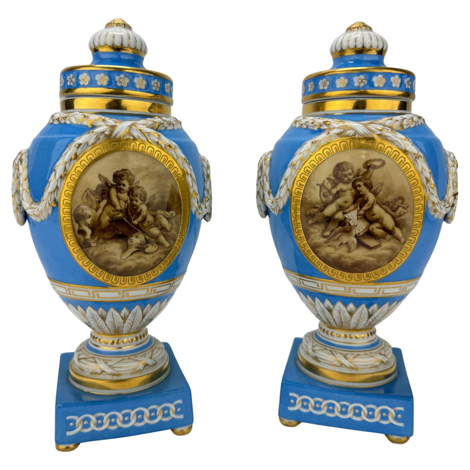 Pair of 19th C. KPM Celestial Blue & Grisaille Urns: Pair of 19th C. KPM Celestial Blue & Grisaille Urns This exquisite pair of 19th-century lidded urns, crafted by the esteemed Koenigliche Porzellan-Manufaktur (KPM) of Berlin, showcases the Neoclassica