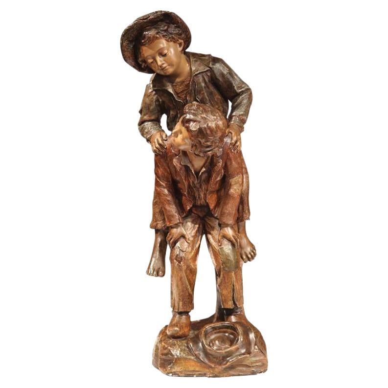 19th Century Terracotta Sculpture by G. Van Vaerenbergh of Boys Playing: 19th Century Terracotta Sculpture by G. Van Vaerenbergh of Boys Playing This exquisite 19th Century Belgian Terracotta Sculpture by Gustave Van Vaerenbergh showcases a playful scene of two young boys