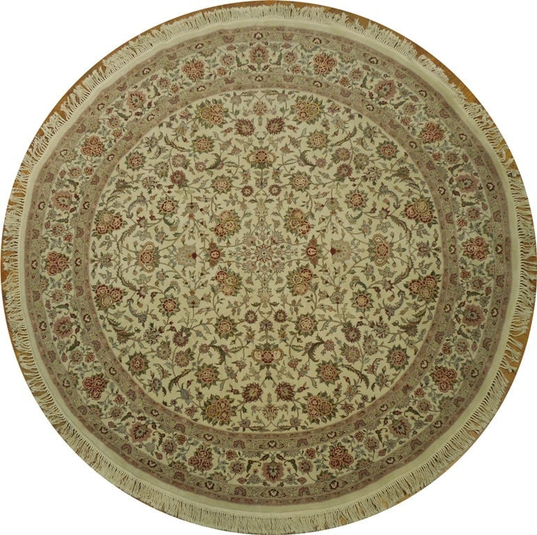 7.10 x 8 Round Hand Knotted Wool and Silk Luxury Rug: 7.10 x 8 Round Hand Knotted Wool and Silk Luxury Rug Free continental US Shipping This round rug measures 7.10 x 8 feet and is expertly hand-knotted from a high-quality blend of wool and silk. Its fin