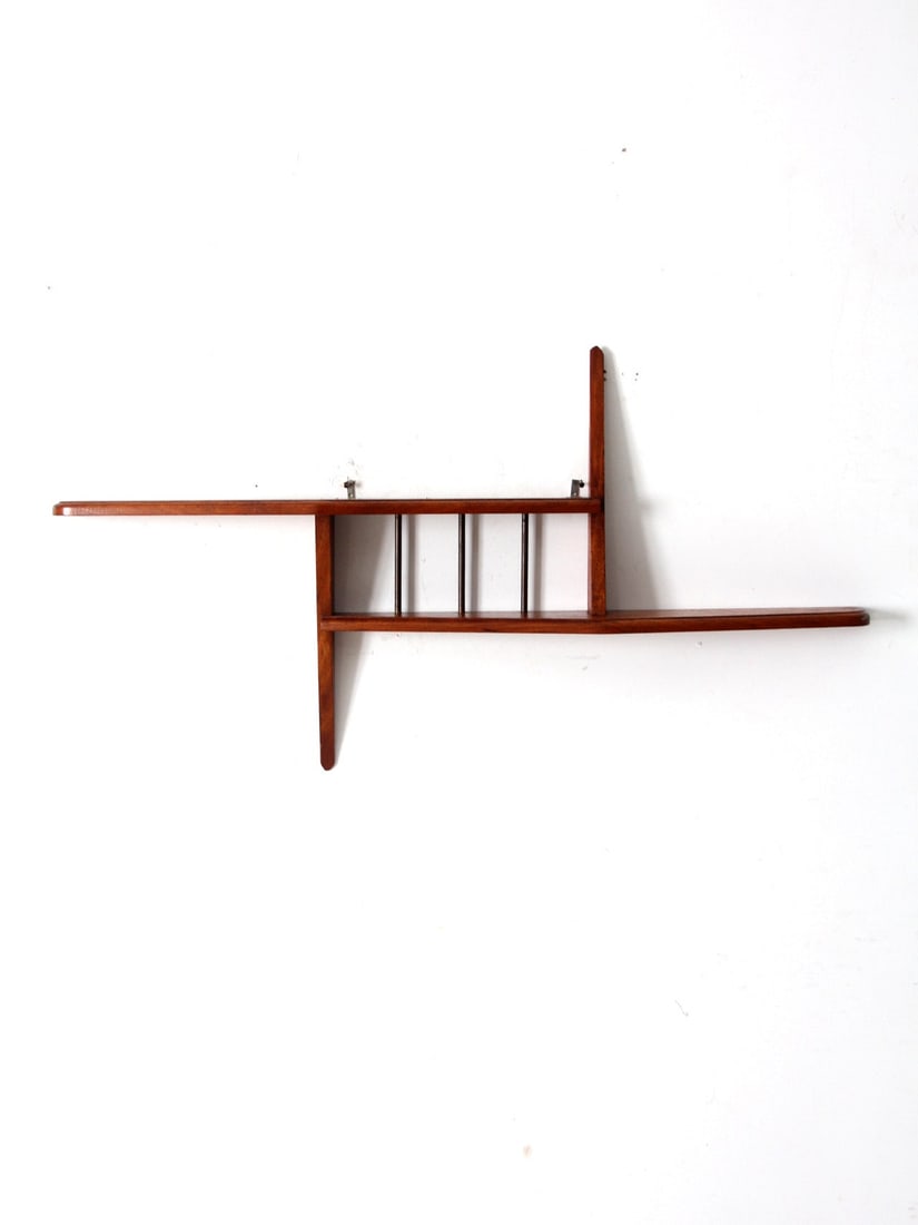 Mid Century Modern Asymmetrical Wooden Wall Shelf 45.25 x 24 x 5.25: Mid Century Modern Asymmetrical Wooden Wall Shelf 45.25 x 24 x 5.25 Elevate your space with this Mid Century Asymmetrical Wall Shelf, a stunning piece from the mid-20th century. This wooden wall shelf