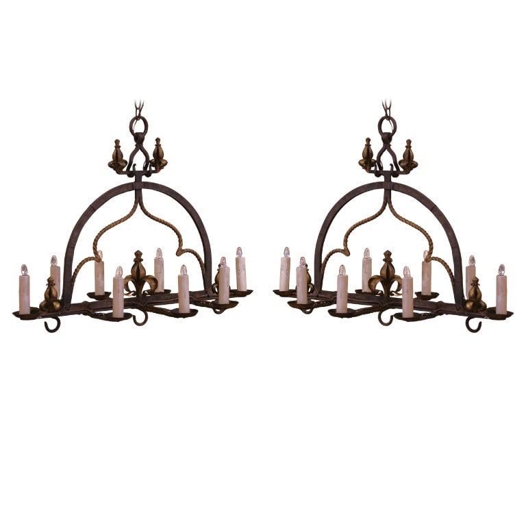 Set of 2 19th Century French Gothic Wrought Iron Eight-Light Chandeliers: Set of 2 19th Century French Gothic Wrought Iron Eight-Light Chandeliers Illuminate your space with this stunning pair of 19th Century French Gothic wrought iron chandeliers, crafted circa 1890. Each