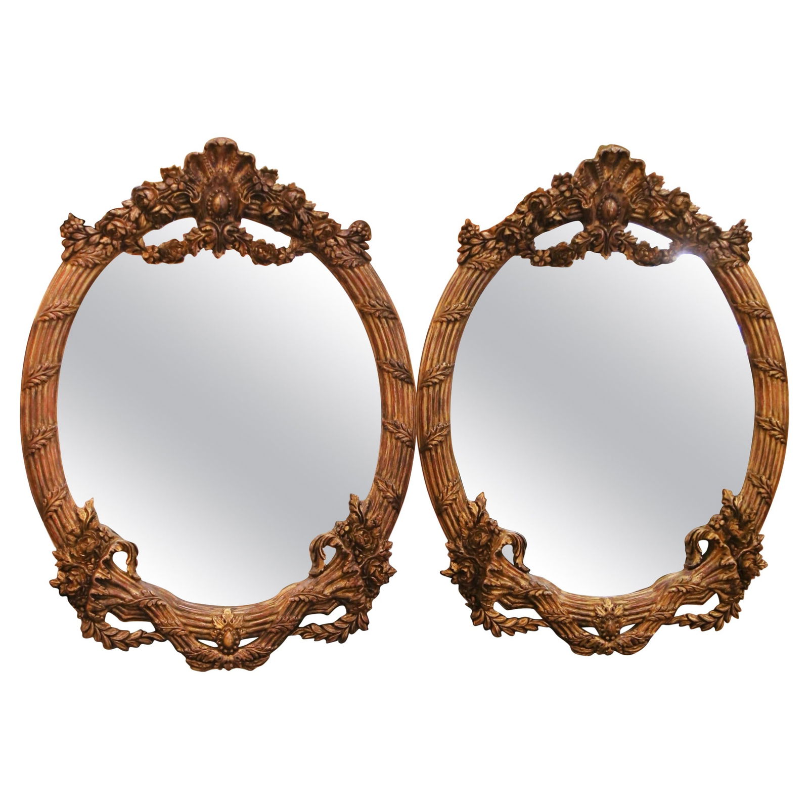 Set of 2 Oval Giltwood Wall Mirrors in French Louis XV Design: Set of 2 Oval Giltwood Wall Mirrors in French Louis XV Design This pair of French Louis XV style wall mirrors features intricately carved, hand-crafted giltwood frames with a patinated finish. Each ov