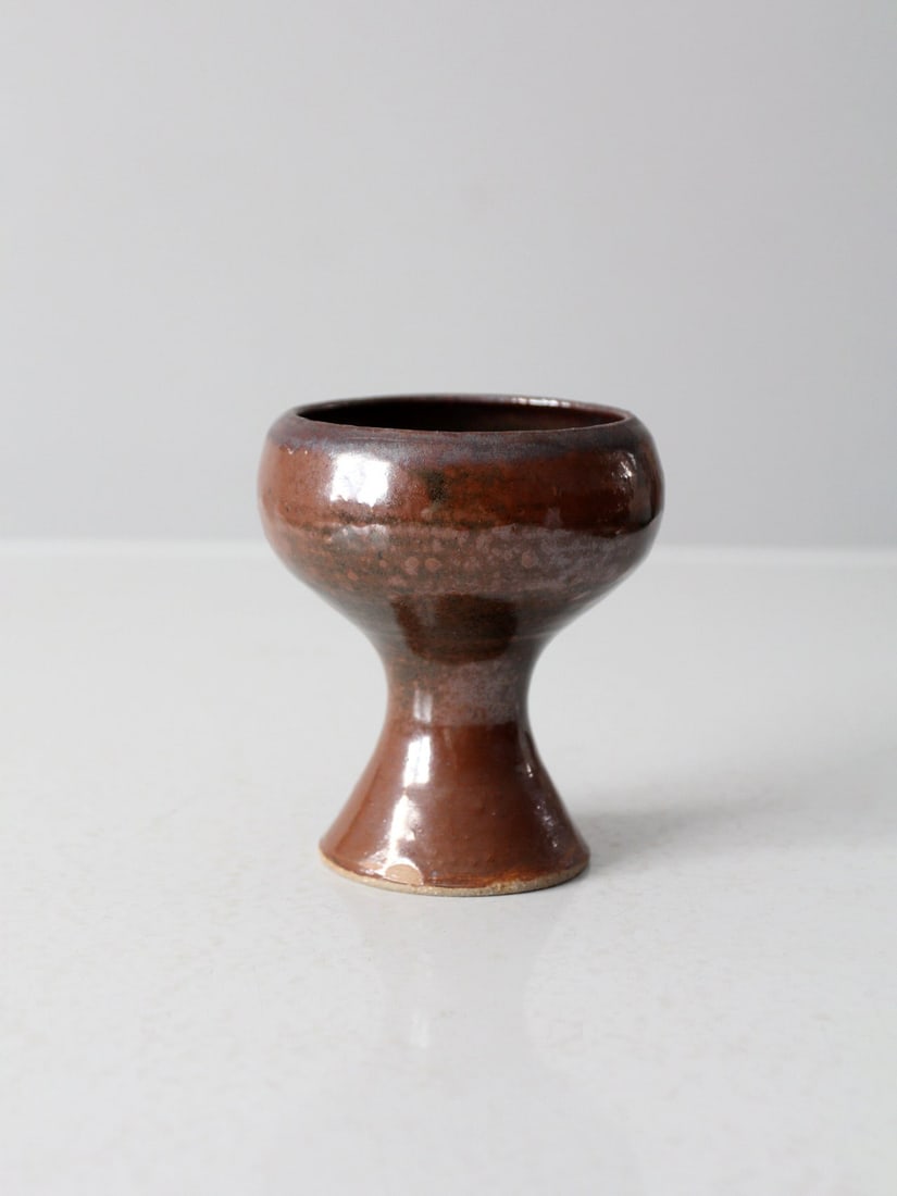 Vintage Studio Pottery Pedestal Bowl Rustic Elegance 4.25": Vintage Studio Pottery Pedestal Bowl Rustic Elegance 4.25" Enhance your home decor with this Vintage Studio Pottery Pedestal Bowl. Featuring a graceful shape and a warm glaze, this handmade bowl adds