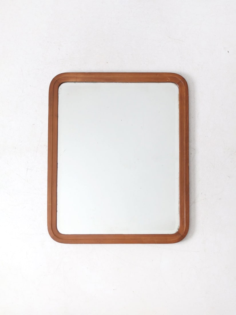 Antique Wood Frame Beveled Glass Wall Mirror 33 x 27 Inch: Antique Wood Frame Beveled Glass Wall Mirror 33 x 27 Inch This antique wall mirror showcases a rectangular silhouette framed in warm wood, enhanced by classic beveled glass. Its timeless design makes