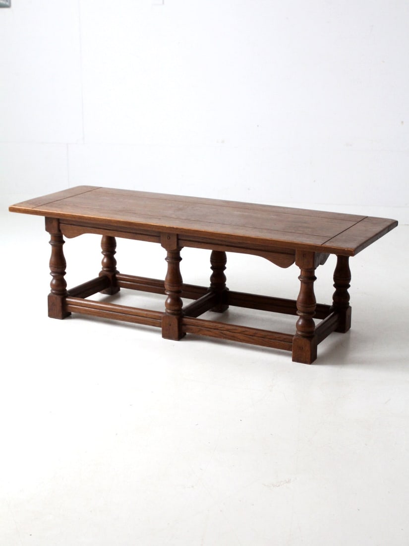 Mid Century Rustic Oak Coffee Table Solid Oak Lodge Design: Mid Century Rustic Oak Coffee Table Solid Oak Lodge Design This substantial mid-20th century oak coffee table features a rustic, lodge-inspired design, expertly crafted from solid oak. It showcases a
