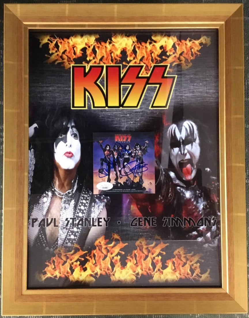 KISS Signed CD Booklet by Gene Simmons Paul Stanley Custom Framed JSA: KISS Signed CD Booklet by Gene Simmons Paul Stanley Custom Framed JSA This custom framed CD booklet cover features the authentic signatures of rock legends Gene Simmons and Paul Stanley from KISS. The