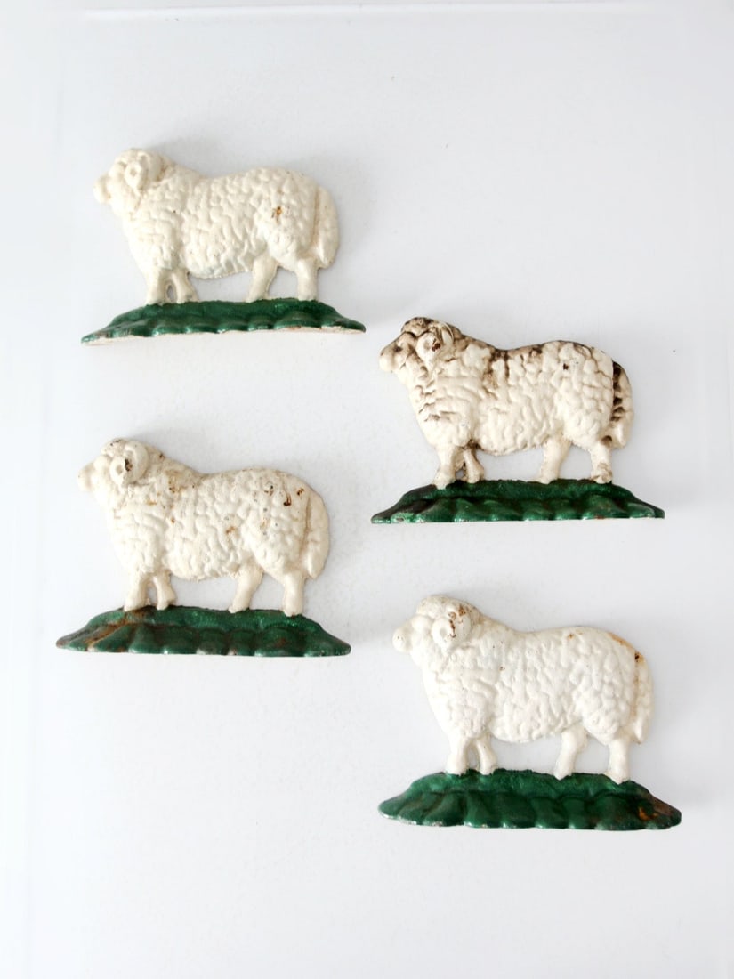 Charming Set of 4 Antique Cast Iron Sheep Door Stops: Charming Set of 4 Antique Cast Iron Sheep Door Stops Enhance your home decor with this charming set of four antique cast iron sheep door stops. Each piece is beautifully shaped like sweet rams and fea