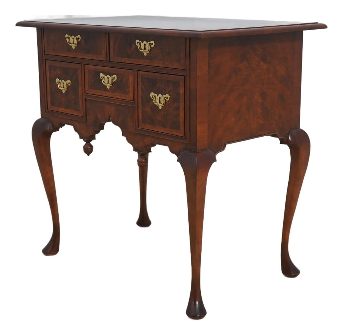 Baker 8868 Colonial Williamsburg Walnut Lowboy Dressing Table: Baker 8868 Colonial Williamsburg Walnut Lowboy Dressing Table This exquisite Colonial Williamsburg Model 8868 Lowboy Dressing Table showcases a beautiful walnut finish with herringbone inlay work. Cra