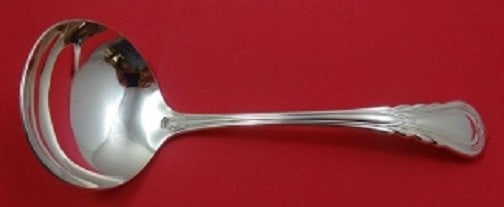 Carrs Lily Sterling Silver Gravy Ladle 7 1/4 inches Unused: Carrs Lily Sterling Silver Gravy Ladle 7 1/4 inches Unused Introducing the exquisite Lily by Carrs Sterling Silver Gravy Ladle, measuring 7 1/4 inches. This elegant piece features the timeless Lily