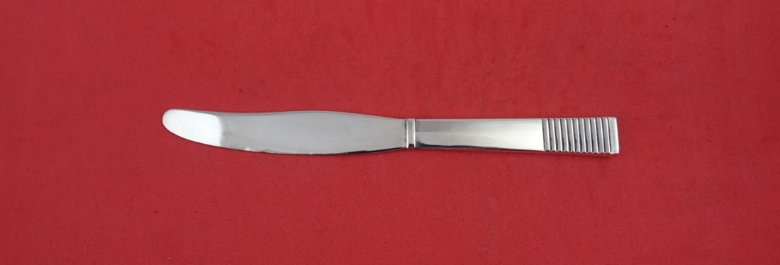 Georg Jensen Parallel Sterling Silver Junior Knife 6 1/4 inch: Georg Jensen Parallel Sterling Silver Junior Knife 6 1/4 inch This exquisite junior knife is crafted from sterling silver and features the iconic Parallel pattern by Georg Jensen. Measuring 6 1/4