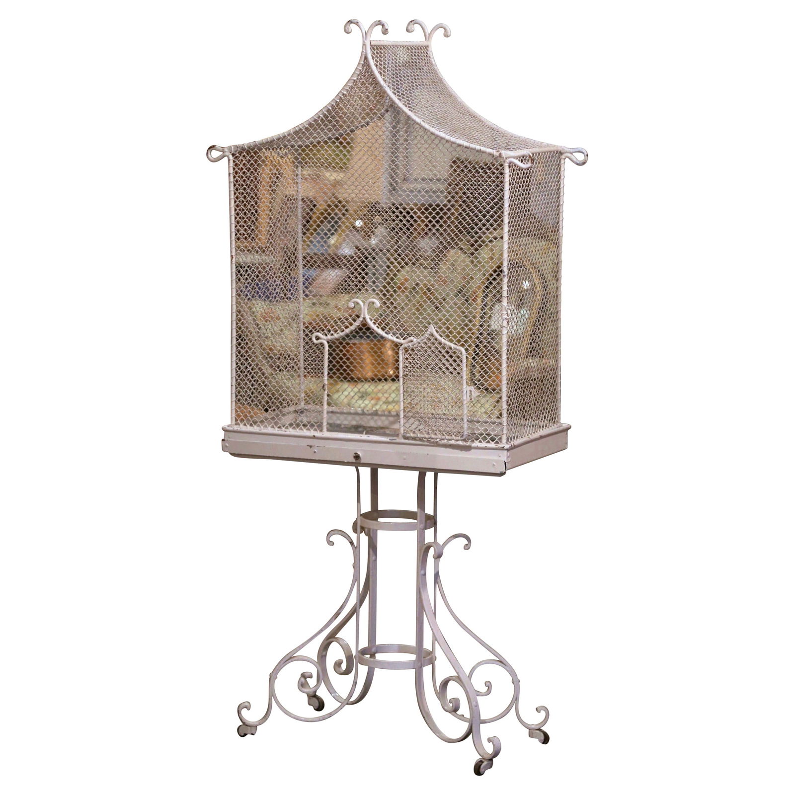 Art Deco French Iron Pagoda Bird Cage on Wheels Circa 1920: Art Deco French Iron Pagoda Bird Cage on Wheels Circa 1920 Add a touch of whimsical charm to your kitchen, conservatory, or breakfast room with this elegant antique aviary. Crafted in France circa 192