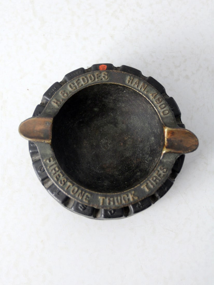 Vintage Firestone Tires Advertising Ashtray Brass Insert Design: Vintage Firestone Tires Advertising Ashtray Brass Insert Design This antique Firestone Truck Tires advertising ashtray showcases a unique design featuring a hard rubber "tire" frame that holds a remov