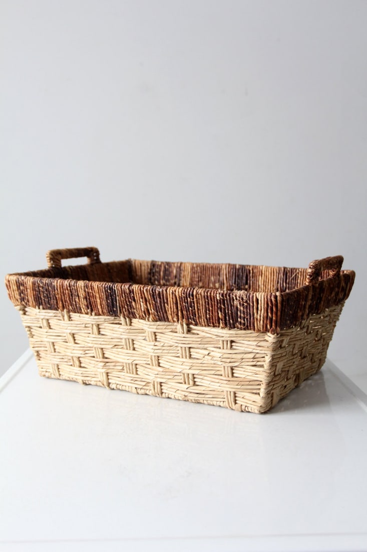 Vintage Woven Jute Storage Basket with Handles 21 x 15 x 8.5: Vintage Woven Jute Storage Basket with Handles 21 x 15 x 8.5 This vintage storage basket combines functionality and charm, featuring a woven jute construction with elegant brown detailing around the t