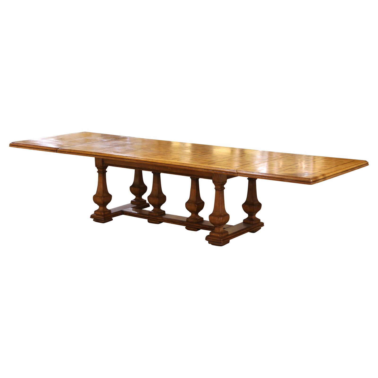 Elegant Louis XIV Extendable Oak Dining Table with Parquetry Top: Elegant Louis XIV Extendable Oak Dining Table with Parquetry Top This exquisite early 20th century French dining table, crafted circa 1920, features a stunning parquetry top and solid oak construction