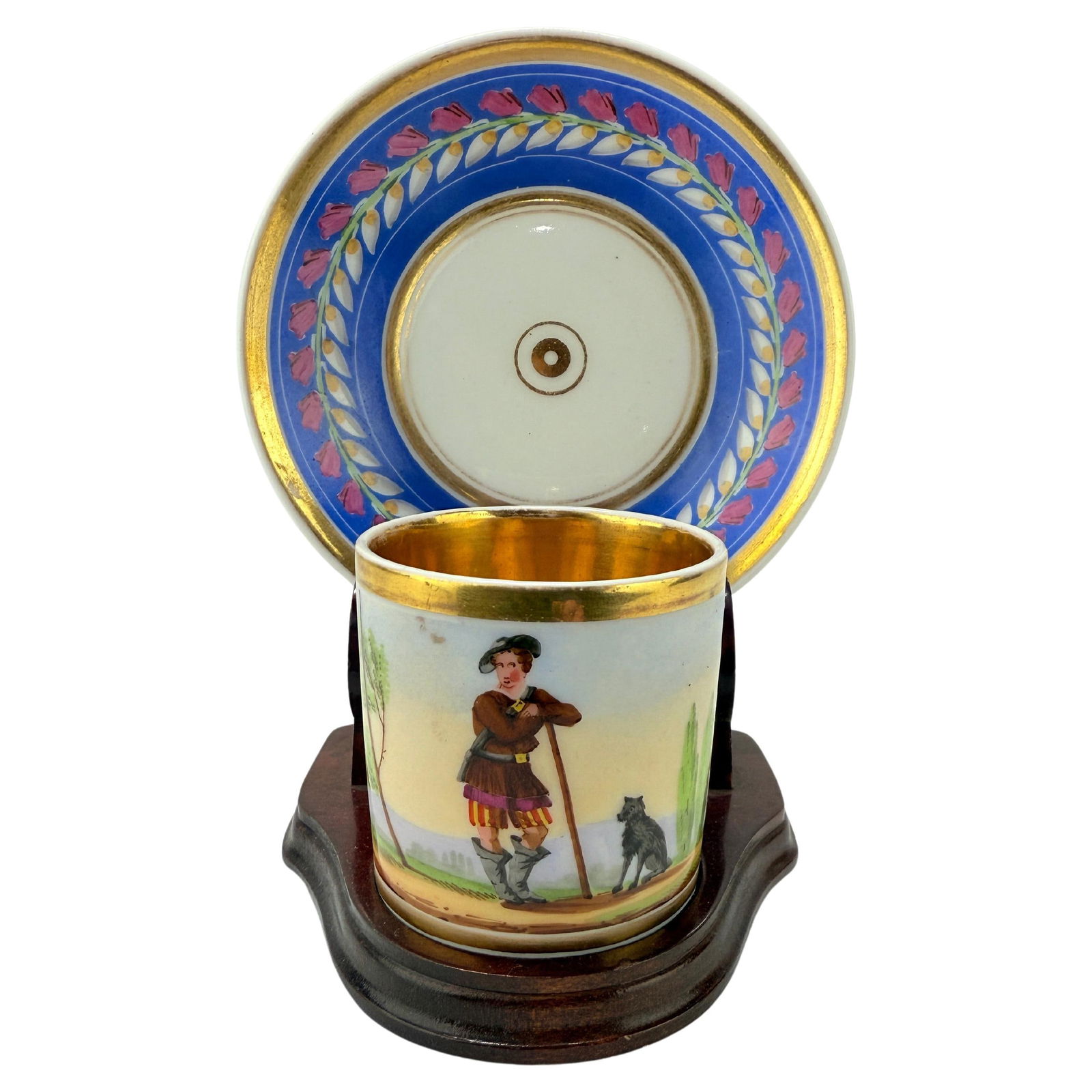19th Century Neoclassical French Porcelain Cup & Saucer Set with Young Man and Dog: 19th Century Neoclassical French Porcelain Cup & Saucer Set with Young Man and Dog This exquisite 19th-century Neoclassical cup and saucer set showcases the elegance of fine French porcelain