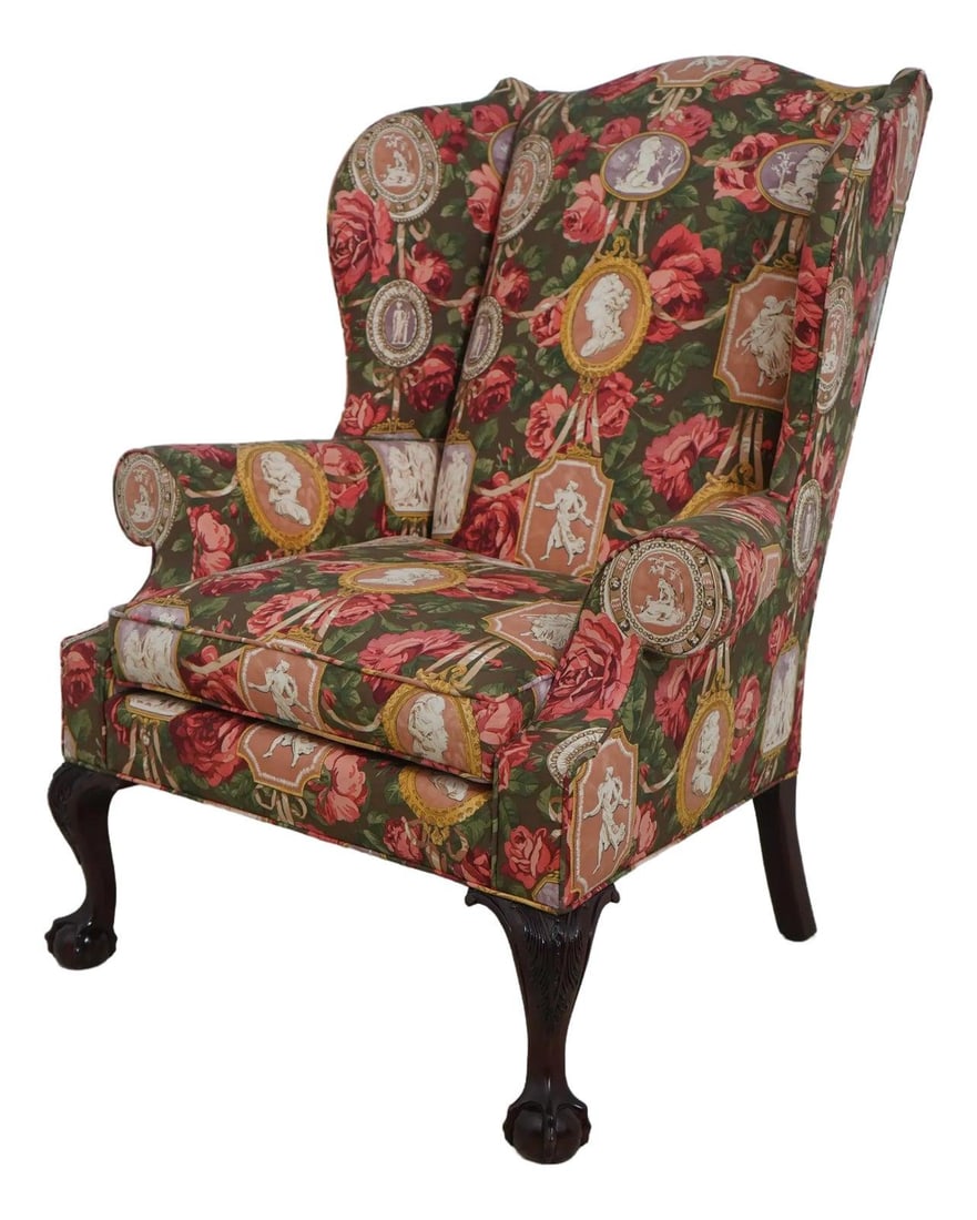 Kindel Mahogany Chippendale Wing Chair with Floral Upholstery: Kindel Mahogany Chippendale Wing Chair with Floral Upholstery This exquisite Kindel Mahogany Chippendale Style Wing Chair showcases timeless elegance with its intricate carvings and high-quality