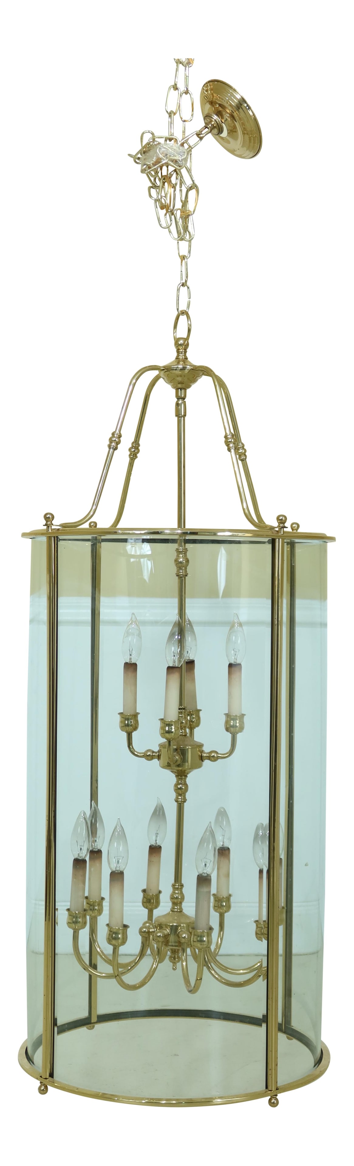 Elegant 12 Light Traditional Brass Chandelier with Bowed Glass: Elegant 12 Light Traditional Brass Chandelier with Bowed Glass This elegant large round chandelier features 12 lights and showcases traditional craftsmanship with its quality construction. The fixture