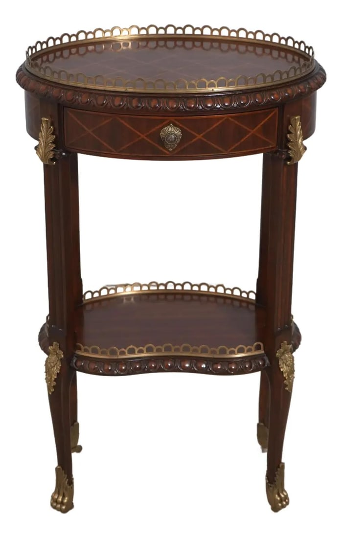 Maitland Smith Mahogany Oval Occasional Table with Brass Accents: Maitland Smith Mahogany Oval Occasional Table with Brass Accents This exquisite Maitland Smith oval boudoir occasional table showcases a rich mahogany construction with elegant paw feet featuring cast