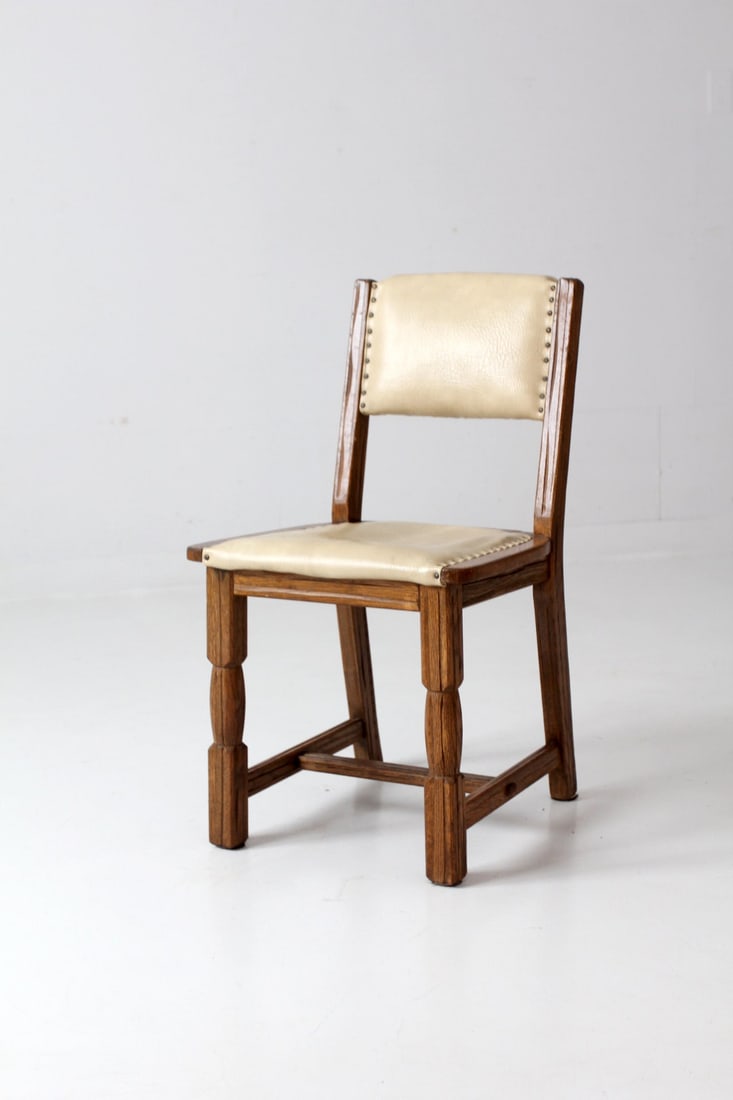 Vintage Mission Style Wooden Side Chair with Cream Leather Upholstery: Vintage Mission Style Wooden Side Chair with Cream Leather Upholstery This vintage Mission style side chair brings a touch of classic elegance to any dining space. Crafted from wood, it showcases a cr