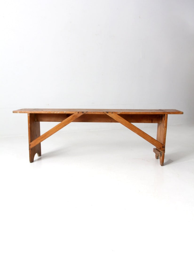 Early 20th Century Vintage Primitive Wood Bench 58.25 x 10 x 18.5: Early 20th Century Vintage Primitive Wood Bench 58.25 x 10 x 18.5 This early 20th-century vintage primitive wood bench showcases a charming design with a single plank top seat, cross supports, and boa