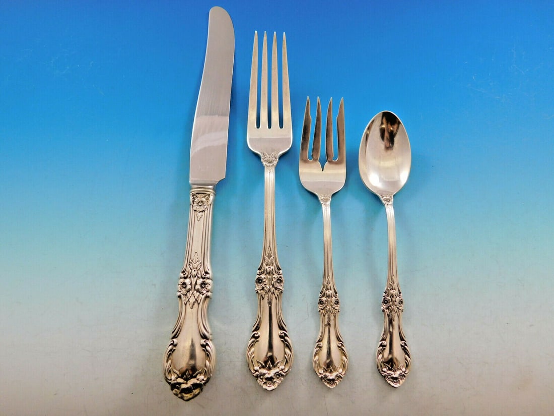 International Sterling Silver Wild Rose Flatware Set 32 pcs for 8: International Sterling Silver Wild Rose Flatware Set 32 pcs for 8 Enhance your dining experience with the exquisite Wild Rose Flatware Set by International Sterling. This 32-piece set, crafted from