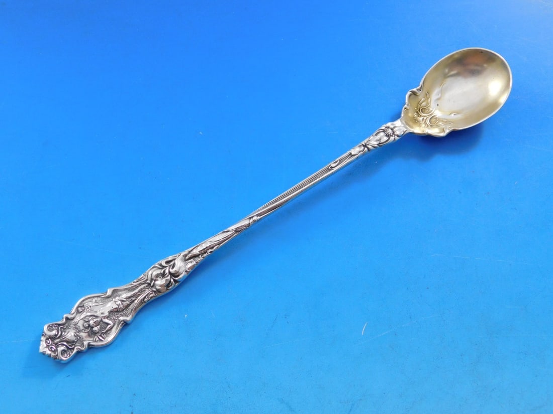 Wallace Irian Sterling Silver Olive Spoon 7 7/8" Gold Washed: Wallace Irian Sterling Silver Olive Spoon 7 7/8" Gold Washed This exquisite serving spoon features the Irian pattern by Wallace, crafted from high-quality sterling silver. The spoon measures 7 7/8" in