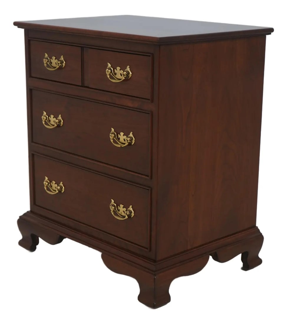 Three Drawer Cherry Wood Nightstand with Brass Hardware Circa 1985: Three Drawer Cherry Wood Nightstand with Brass Hardware Circa 1985 This Stickley nightstand chest features three drawers crafted from solid cherry wood with dovetailed construction for lasting durabil