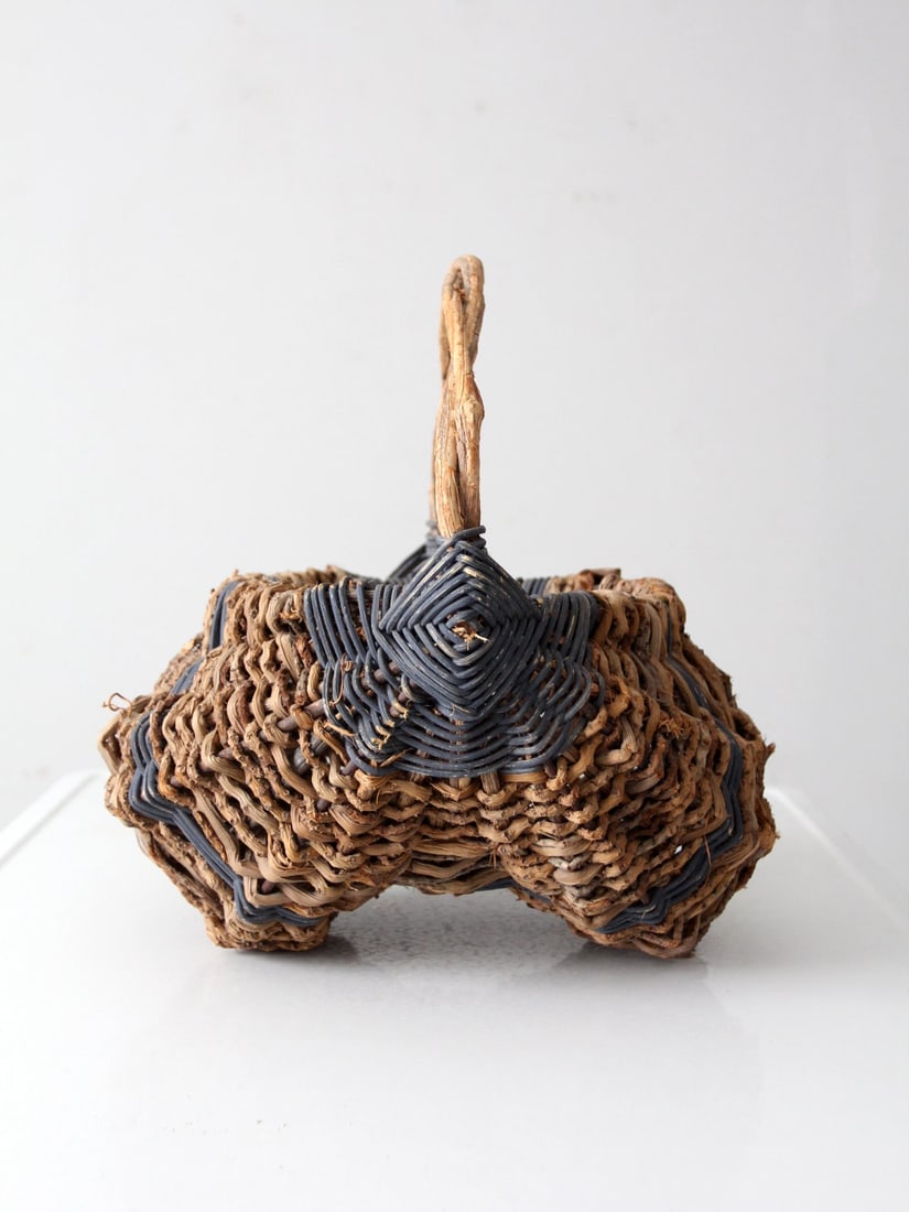 Vintage Buttocks Basket with Blue Banding 15 x 15.5 Inch: Vintage Buttocks Basket with Blue Banding 15 x 15.5 Inch This vintage buttock basket showcases a delightful design with soft blue banding set against its natural tone. The arched handle and balanced s