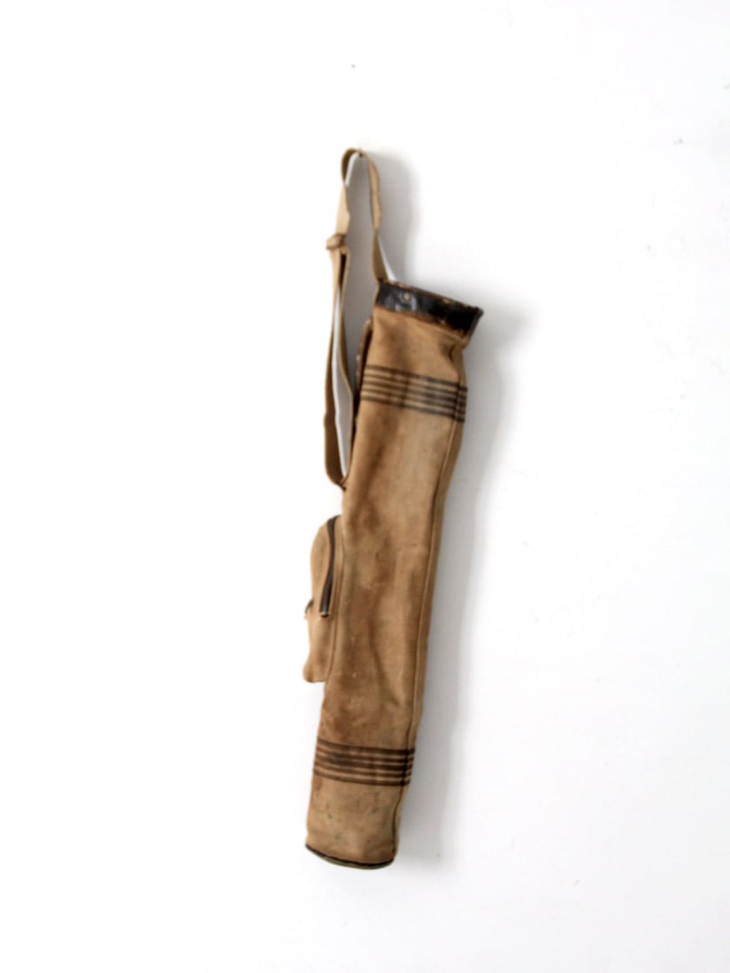1920s Antique Striped Canvas Golf Club Bag with Leather Trim: 1920s Antique Striped Canvas Golf Club Bag with Leather Trim Discover a charming piece of golfing history with this antique golf club bag from the 1920s. Crafted from striped canvas, it features a stu