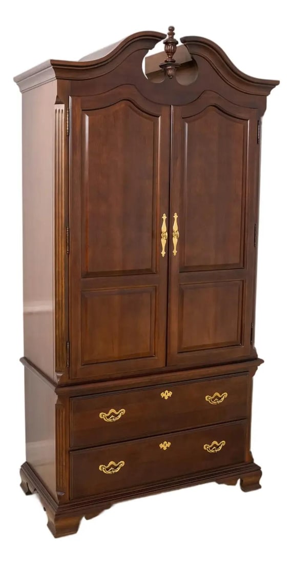 Thomasville Cherry Armoire Traditional Style 2 Door Mahogany Finish: Thomasville Cherry Armoire Traditional Style 2 Door Mahogany Finish This elegant Thomasville 2 Door Cherry Bedroom Armoire showcases a traditional design, approximately 30 years old. Crafted from rich