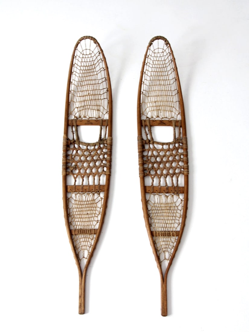 Vintage CA Lund Trail Style Snowshoes 54 x 10 Inches: Vintage CA Lund Trail Style Snowshoes 54 x 10 Inches Discover a beautiful pair of vintage CA Lund snowshoes, perfect for adding a rustic touch to your chalet decor. These elongated, trail-style snowsh