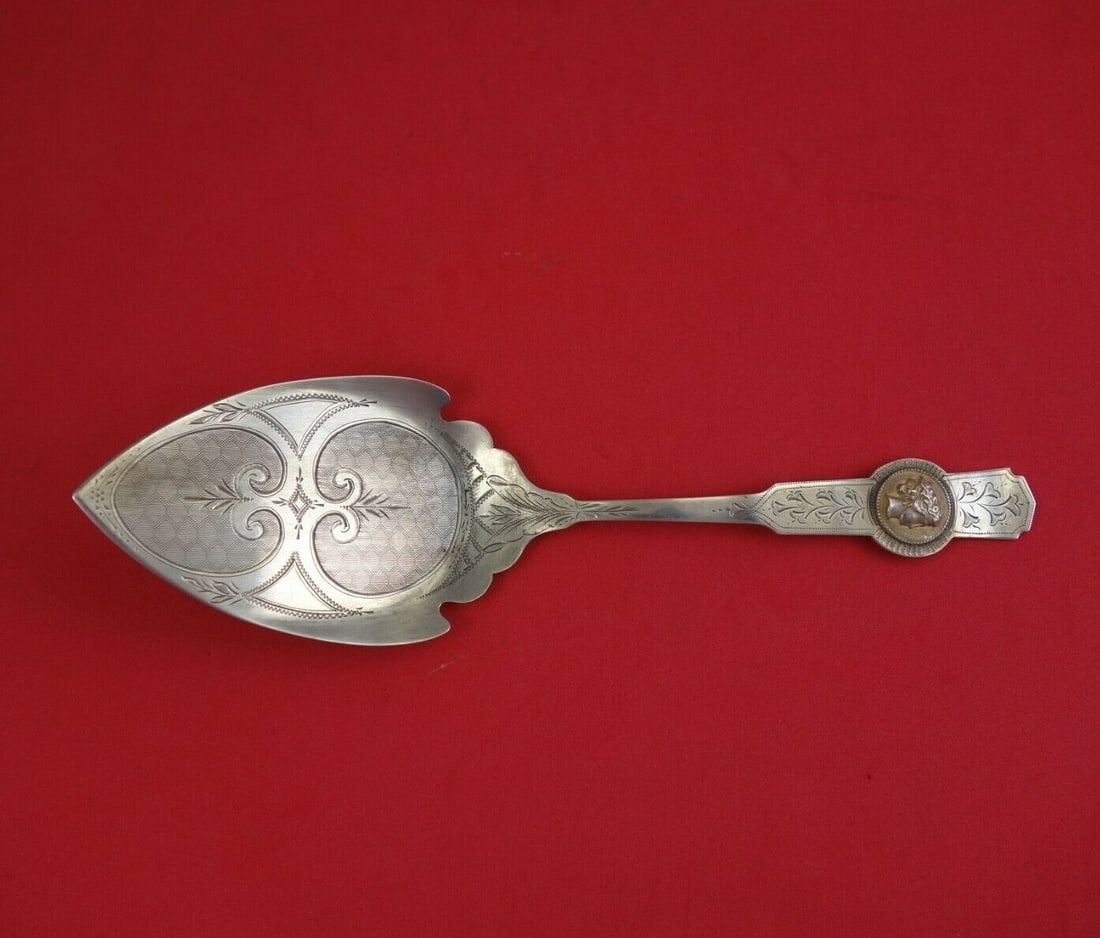 Coin Silver Pie Server with Bright-Cut Design and Medallion 9 Inch: Coin Silver Pie Server with Bright-Cut Design and Medallion 9 Inch This exquisite 9" pie server is crafted from coin silver, featuring a beautifully bright-cut design and an applied medallion. The fla