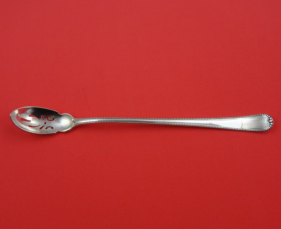 Gorham Newcastle Sterling Silver Long Pierced Olive Spoon 8 1/4": Gorham Newcastle Sterling Silver Long Pierced Olive Spoon 8 1/4" Discover the elegance of the Newcastle by Gorham Sterling Silver Olive Spoon. This exquisite, long, pierced slotted spoon measures 8 1/