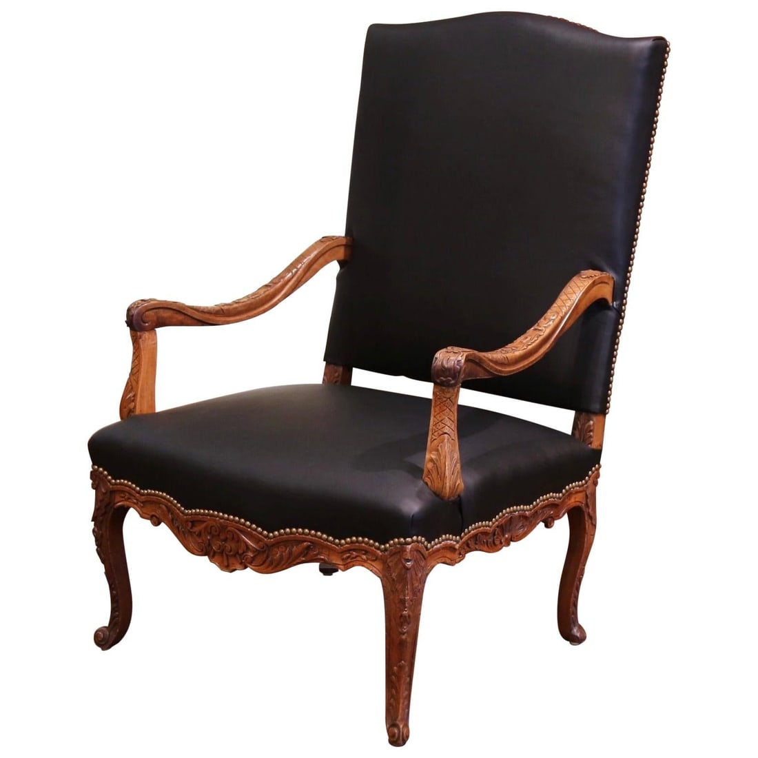 19th Century Louis XV Hand-Carved Walnut Armchair with Black Leather: 19th Century Louis XV Hand-Carved Walnut Armchair with Black Leather This exquisite 19th Century Louis XV armchair is a stunning addition to any study or office. Crafted in Provence circa 1880, it fea