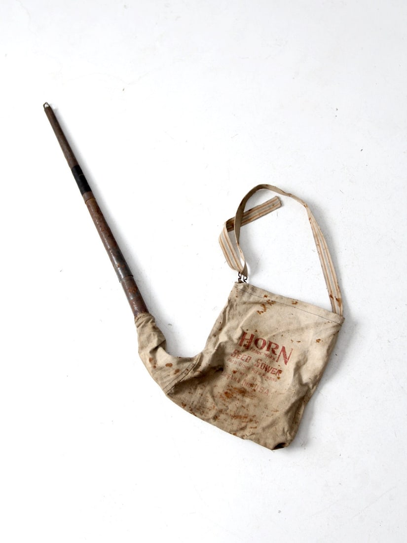 Vintage 1910s-1920s Antique Horn Seed Sower with Canvas Satchel: Vintage 1910s-1920s Antique Horn Seed Sower with Canvas Satchel Discover this charming Antique Horn Seed Sower, a unique piece dating back to the 1910s-1920s. This primitive hand seeder features a cre