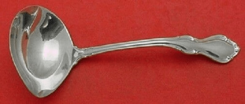 Reed and Barton Hampton Court Sterling Silver Gravy Ladle 6.5 Inch: Reed and Barton Hampton Court Sterling Silver Gravy Ladle 6.5 Inch Introducing the Hampton Court Gravy Ladle by Reed and Barton, a beautifully crafted piece in sterling silver. This elegant ladle, mea